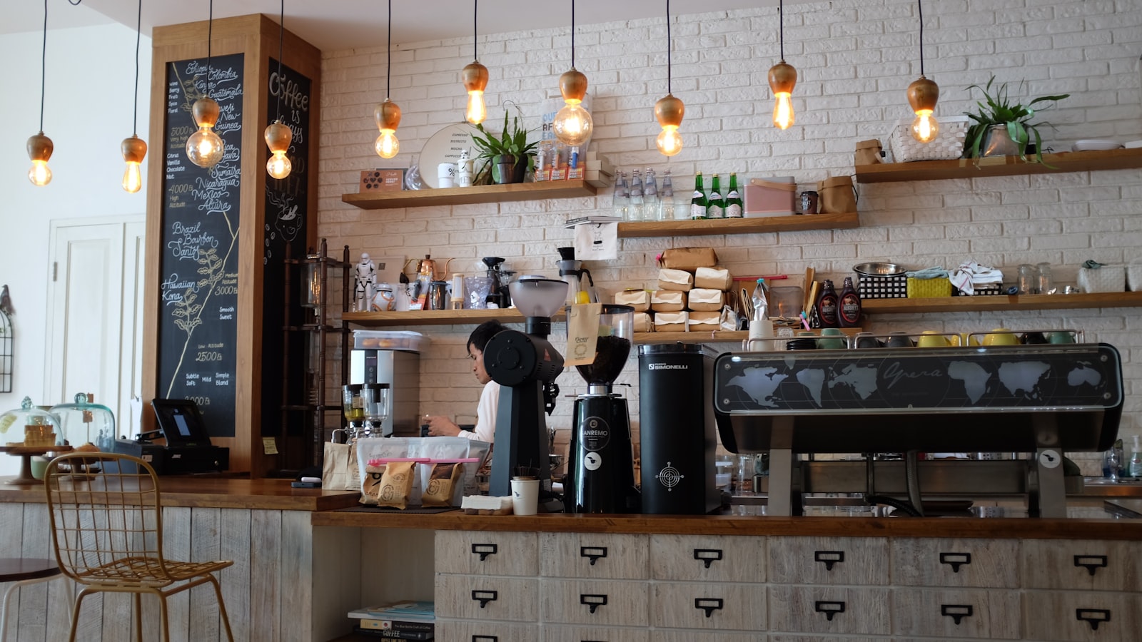 A modern specialty cafe counter with brewing equipment
