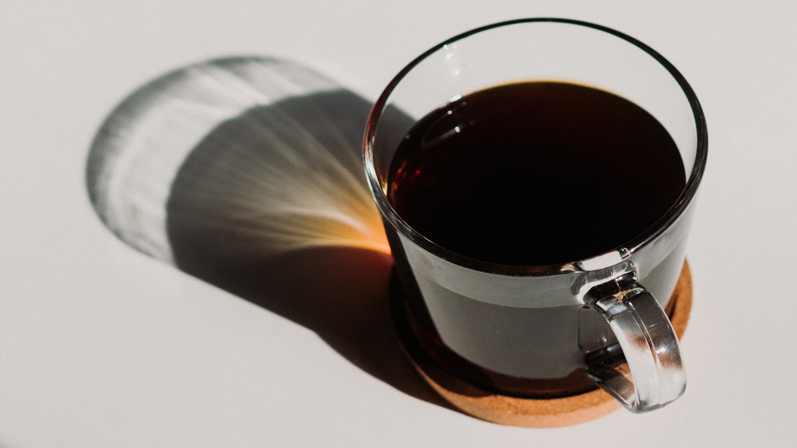 A flight of coffee cups set up for tasting on a table